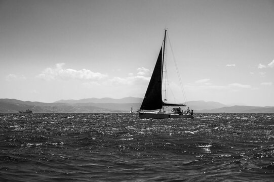 Between sea and lagoon. Sailing trip between the Marano lagoon and the Gulf of Trieste. Black and white.