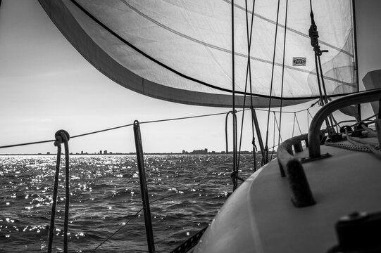 Between sea and lagoon. Sailing trip between the Marano lagoon and the Gulf of Trieste. Black and white.