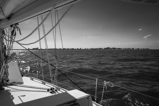 Between sea and lagoon. Sailing trip between the Marano lagoon and the Gulf of Trieste. Black and white.