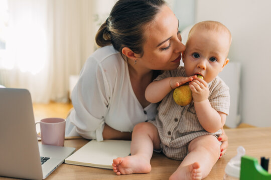 Mother is showing love to her baby.