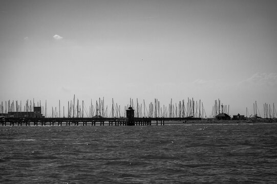 Between sea and lagoon. Sailing trip between the Marano lagoon and the Gulf of Trieste. Black and white.