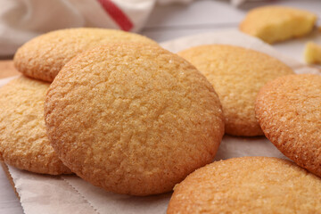 Delicious Danish butter cookies on wooden board, closeup