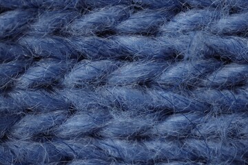 Macro photo of blue knitted fabric as background, top view