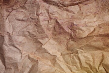 Texture of crumpled parchment paper as background, top view