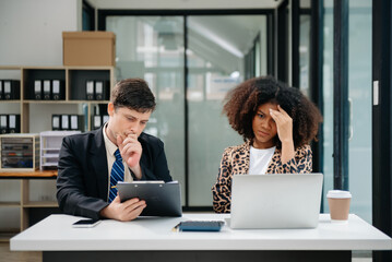 Furious two businesspeople arguing strongly after making a mistake at work in modern office