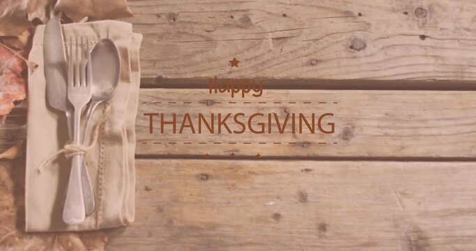 Animation of happy thanksgiving day text over cutlery