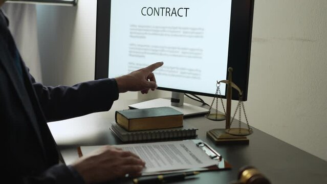 Young lawyer or legal advisor is reading and carefully checking the validity of documents and investment agreements for signing contracts managing justice concepts.
