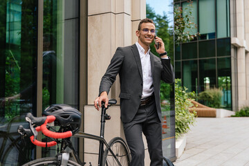 Handsome young businessman talking on the phone