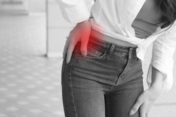 asian woman suffering from hip joint pain, pelvic hip joint dislocation, arthritis, gout sypmtoms