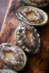 Fresh abalone on cutting board