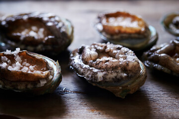 Fresh abalone on cutting board