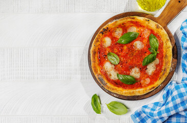 Margarita pizza with tomatoes, mozzarella cheese and basil