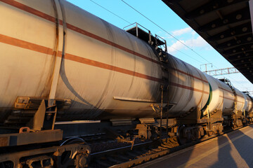 Fototapeta na wymiar railway tank cars, railroad station platform, concept of freight transportation by rail, industrial cargo transport