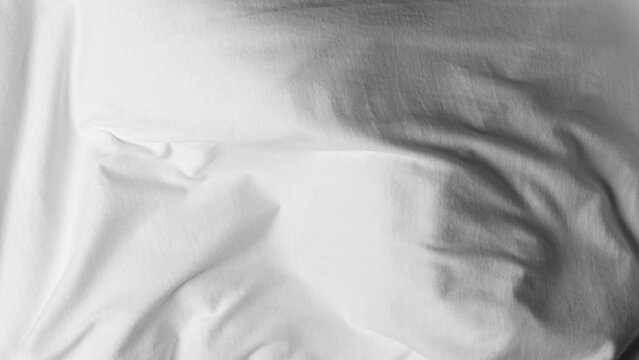 White fabric blowing in slow motion
