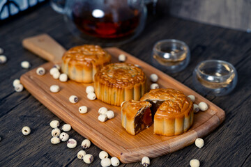 Chinese mid-autumn mooncake festival with egg yolk and tea