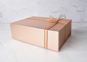 beautiful festive Christmas birthday premium luxury gift box packaging in shining bronze color and...