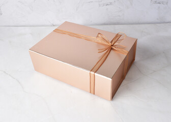 beautiful festive Christmas birthday premium luxury gift box packaging in shining bronze color and...