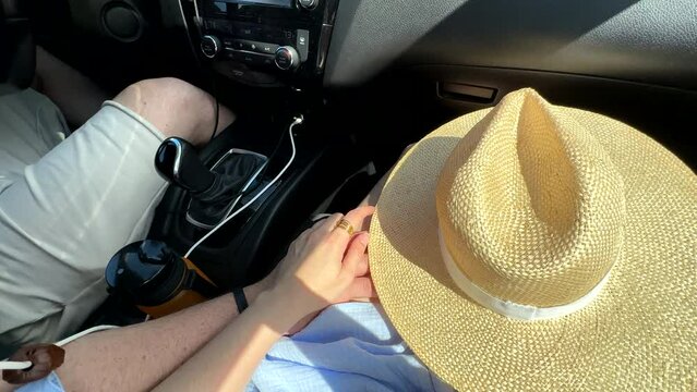 man touch woman lag while driving car