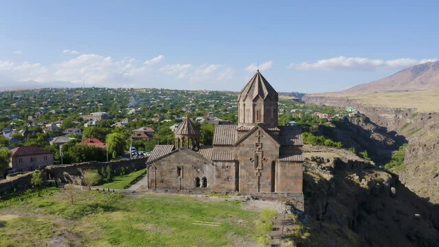 Orbital aerial shot of Hovhannavank monastery and Kasakh canyon on sunny summer day. Ohanavan village, Armenia.