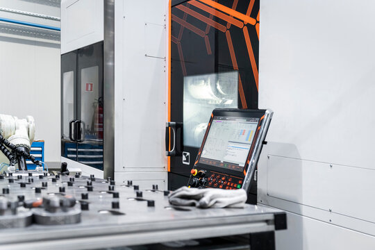 Computer with machine at industry