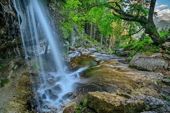 Waterfall with rocky landscape in forest
