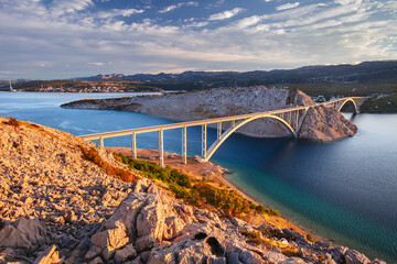 Krk Bridge, Croatia. Image of Krk Bridge which connects the Croatian island of Krk with the mainland at beautiful summer sunrise.