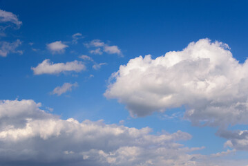 Fluffy white clouds in the blue sky