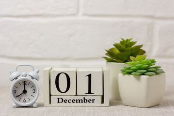 December 1 on the calendar next to the alarm clock is the start date of the new month.