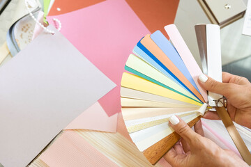 Women in the store choose blinds for windows