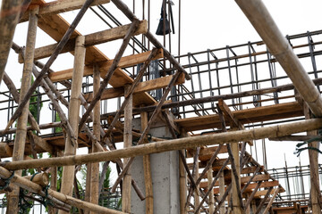 Bamboo scaffolding or crutches in traditional residential construction background