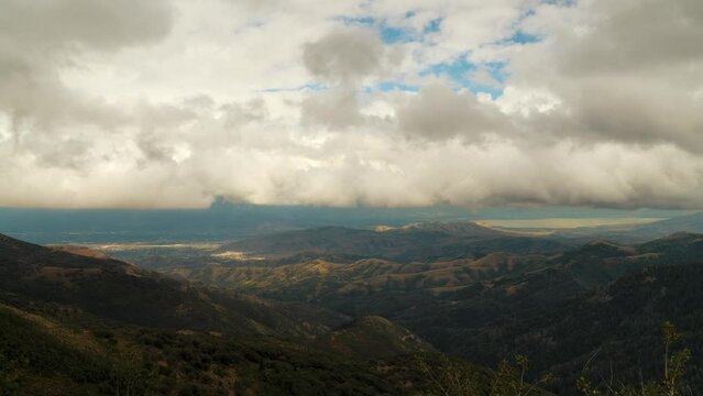 View from the top of the Oquirrh Mountains at Butterfield Canyon into Utah Valley and Utah Lake - dramatic cloudscape time lapse