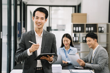 Asian business people working as a good team in the office. Successful teamwork in a meeting, workplace concept.