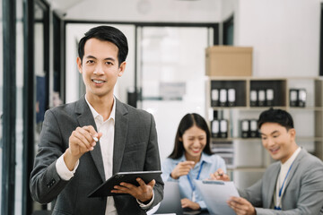 Asian business people working as a good team in the office. Successful teamwork in a meeting, workplace concept.