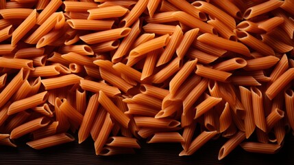 heap of striated penne wholemeal pasta .