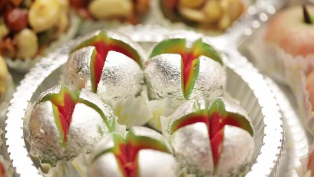 Close-up of Delicious Tricolour Indian sweet Khoya ladoo. Made up of Mawa, Milk, and Sugar.