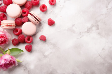 An elegant scene featuring a stylish dessert arrangement with macaroons, raspberries, and floral accents