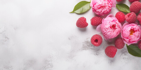 Fototapeta na wymiar A stylish and elegant scene featuring pink peonies and ripe raspberries, and a chic desk setup