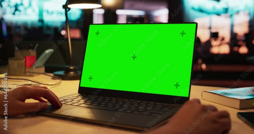 Poster Close Up on Anonymous Designer Working on a Laptop Computer with Mock Up Green Screen Chromakey Display with Isolated Placeholder. Video Template for Artistic Content Creation and Presentations