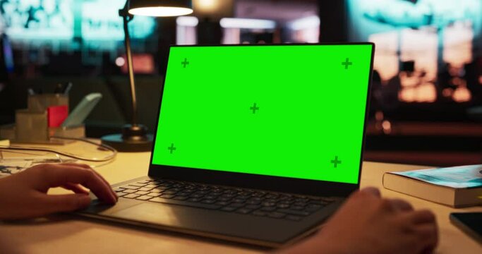 Close Up on Anonymous Designer Working on a Laptop Computer with Mock Up Green Screen Chromakey Display with Isolated Placeholder. Video Template for Artistic Content Creation and Presentations