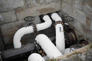 Reconstruction of the underground water supply systems on a city street. Water control main valve