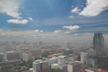 Naklejka na ściany i meble Top view of city scape of Bangkok the capital city of Thailand in haze or smoke around area. Background for environment problem or pollution from PM 2.5 micro dust concept.