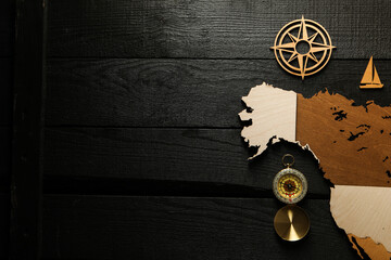 Columbus Day. Vintage compass with wooden model of America