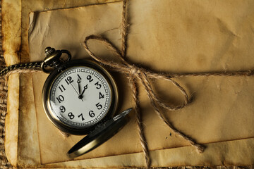 Columbus Day. A pocket watch with a stack of old letters