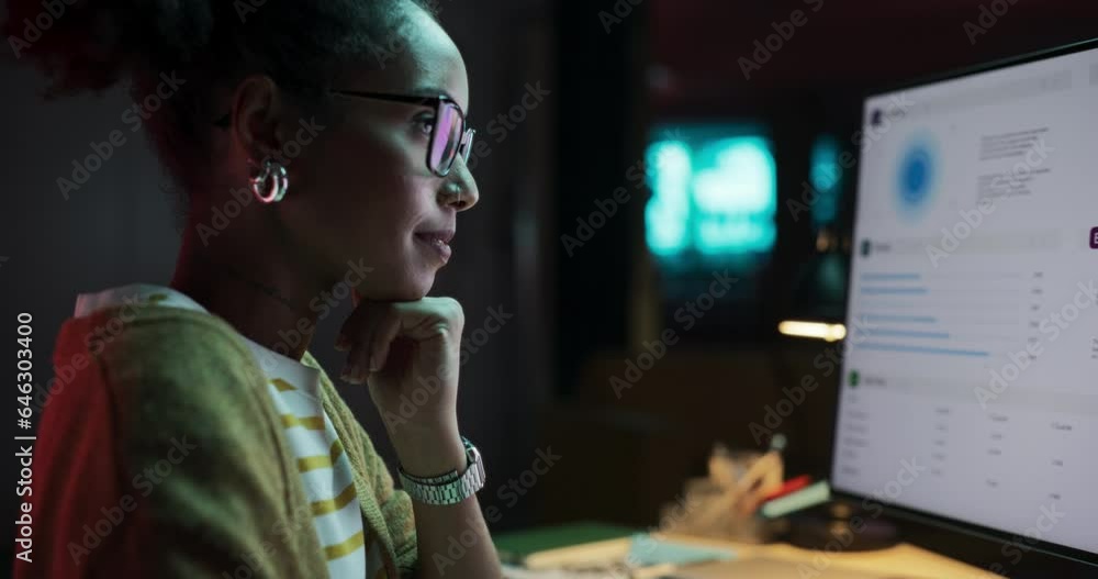 Poster African American Female Smiling While Checking Data and Statistic Charts Using Desktop Computer. Portrait of a Happy Successful Black Businesswoman in Creative Agency in the Evening