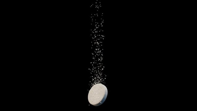 An effervescent tablet dissolving with rising fizz bubbles on a black background