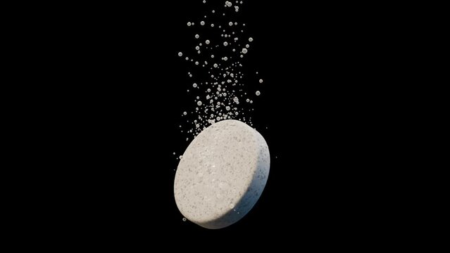 An effervescent tablet dissolving with rising fizz bubbles on a black background