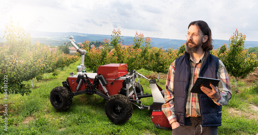 Aufkleber farmer controls autonomous robot in a fruit garden. smart farming concept.