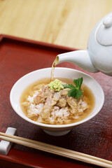 Tai chazuke is a traditional Japanese cuisine.
Sea bream sashimi dipped in sesame sauce on top of rice and served with bancha tea poured over the top.