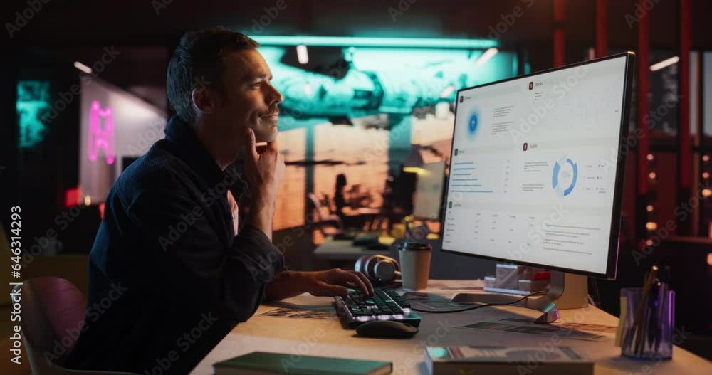 Poster Portrait of Professional Male Developer Using Desktop Computer and Typing in Creative Office. Caucasian Man Analysing Data and Budget for the Lunch of a New Product in Big Gaming Company