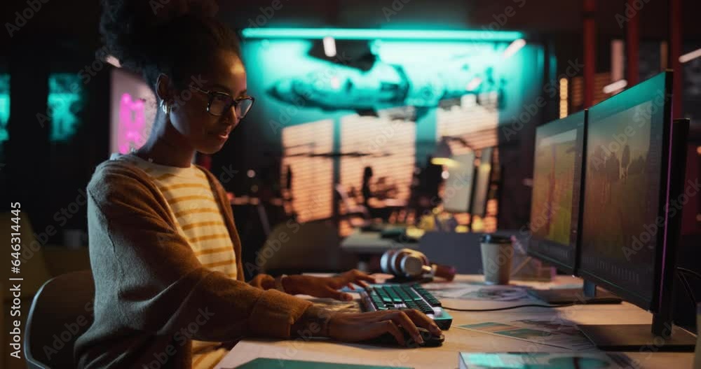 Poster Portrait of Female Video Game Designer Working on a New 3D Level on Desktop Computer in Creative Office. Black Focused Woman Creating Metaverse and Adding Details to a Game Environment